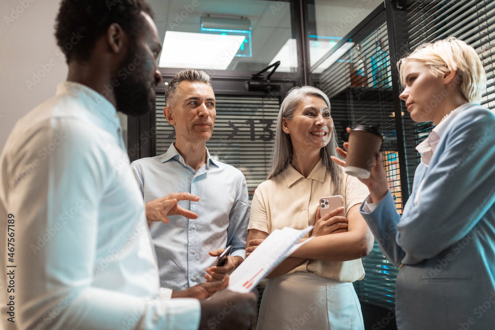 Wall mural cinematic image of a multiethnic business team