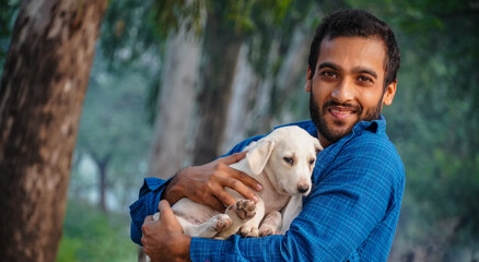 man with cute indian street dog image - cute indian street dog images with man