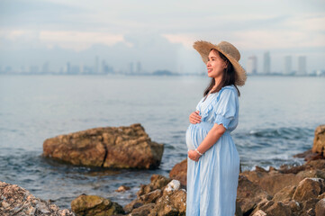 pregnant women travel happy holidays sunset beach background