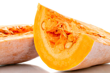 Two halves of ripe organic pumpkin, close-up, isolated on white.
