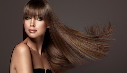 Beautiful model woman with shiny  and straight long hair. Keratin  straightening. Treatment, care...