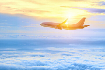 Naklejka na ściany i meble The plane was flying above the clouds.