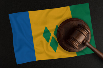Judges hammer and the flag of Saint Vincent and the Grenadines. Law and Justice. Constitutional law
