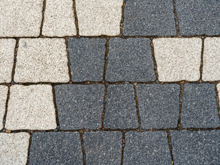 Surface of geometric paving stones made of marble chips. Color - westar hue gray, rhino hue blue. 