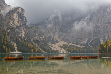 BRAIES, ITALY, October 21, 2021 : Small touristic boats on Lago di Braies. Lake earn the nickname of Pearl of the Alps due to its increasing popularity.