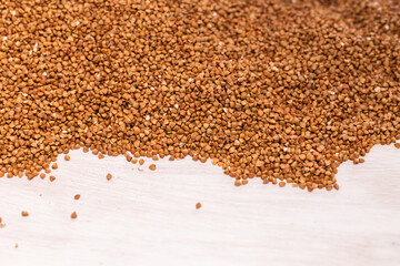 Fresh buckwheat background texture. Cereals and organic food concept