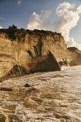 View of Logas Beach and the amazing rocky cliff in Peroulades. Corfu island. Greece