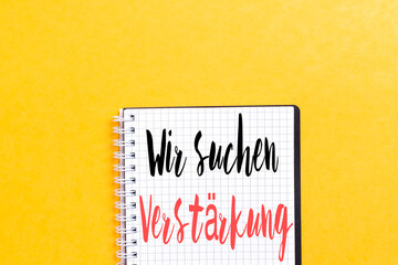 Germany text Wir suchen Verstärkung on notebook which means we are looking for reinforcement