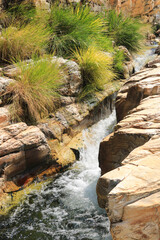 Clean river water flowing through stones, in Capitolio-MG