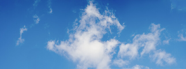 Fototapeta na wymiar Blue sky background with tiny clouds. Panorama