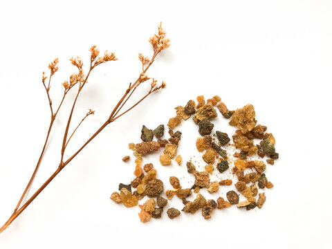 Myrrh is a natural gum or resin extracted from a number of small, thorny tree species of the genus Commiphora Isolated on white