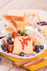 Lemon pund cake with blueberries and strawberry syrup.
