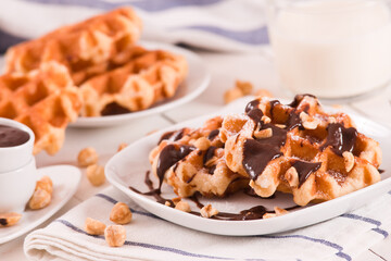 Waffles with chocolate cream and hazelnuts.