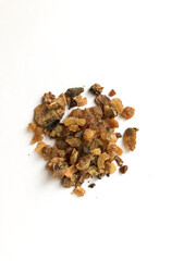 Myrrh is a natural gum or resin extracted from a number of small, thorny tree species of the genus Commiphora Isolated on white