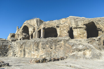 The Uplistsikhe cave complex near Gori, Georgia. Ancient rock-hewn town and three-nave basilica in eastern Georgia. Georgian gourist landmark