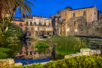 Evening View of the Ruins of the Ancient Greek Temple of Apollo on Ortygia Island in Syracuse, Sicily, Italy - UNESCO World Heritage