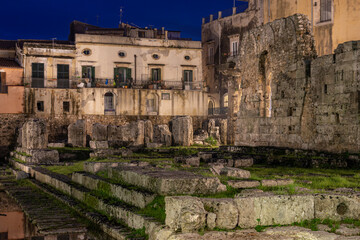 Evening View of the Ruins of the Ancient Greek Temple of Apollo on Ortygia Island in Syracuse, Sicily, Italy - UNESCO World Heritage