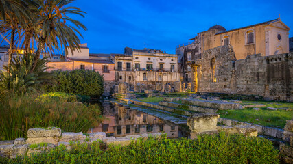 Fototapeta na wymiar Evening View of the Ruins of the Ancient Greek Temple of Apollo on Ortygia Island in Syracuse, Sicily, Italy - UNESCO World Heritage
