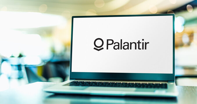 Laptop computer displaying logo of Palantir Technologies