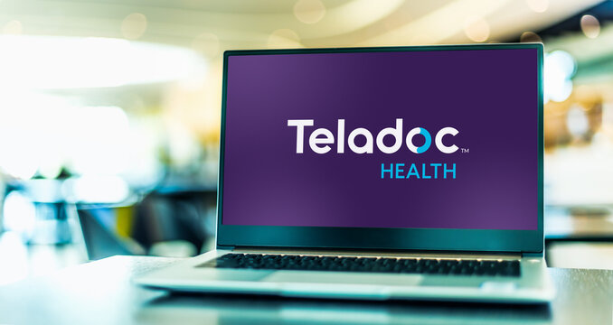 Laptop computer displaying logo of Teladoc Health