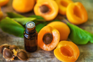 Apricot kernel oil in a bottle. Selective focus.