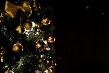 A beautiful festive Christmas tree decorated with Christmas balloon toys in the evening. Close-up.