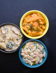 Different types of pasta in bowls