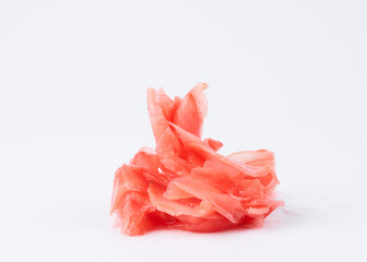 Pile of marinated pink spicy ginger for sushi isolated on white background