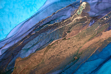 Luxury abstract background in alcohol ink technique, indigo blue gold liquid painting, scattered...