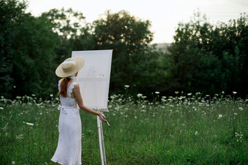 pretty woman in white dress outdoors drawing art creative