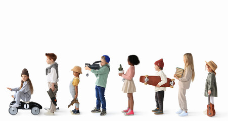 Children are standing in line with different items. A concept on the topic of hobbies. - 467596923
