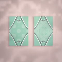 Business card in mint color with abstract white ornament for your brand.