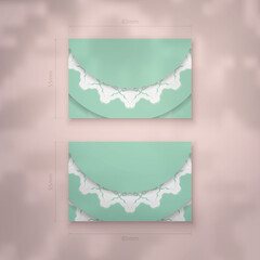 Business card in mint color with vintage white ornament for your brand.
