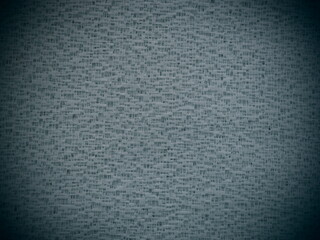 Sheer gray net-like tulle. Mesh fabric. Close-up. Grey veil or muslin. Close-up of a curtain with...