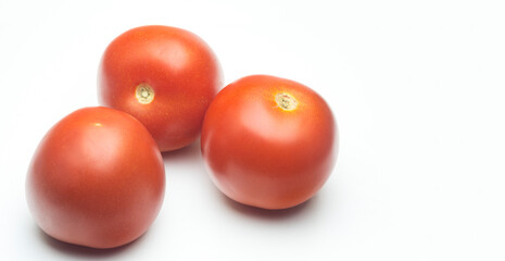 Three tomatoes isolated on white
