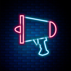 Glowing neon line Spread the word, megaphone icon isolated on brick wall background. Colorful outline concept. Vector