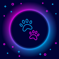 Glowing neon line Paw print icon isolated on black background. Dog or cat paw print. Animal track. Colorful outline concept. Vector