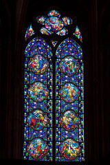 Religious stained glass window inside the cathedral of Verdun in France
