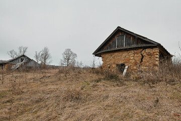 An abandoned rural house in a Russian village, built of stone and clay