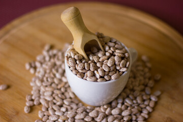 Beans on a wooden background.