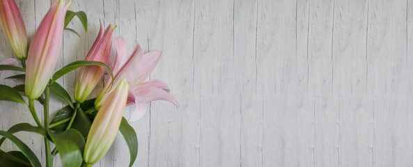 beautiful lily flower on a wooden background