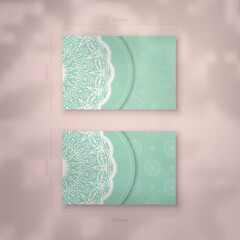 Mint color business card template with Greek white ornaments for your brand.