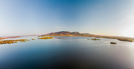 Obraz premium Panorama view on lake with hills on horizon