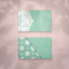 Mint color business card template with vintage white ornament for your business.