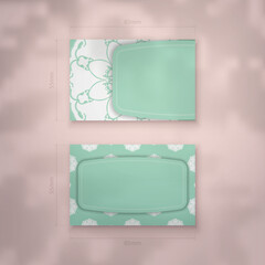 Mint color business card template with vintage white ornament for your contacts.