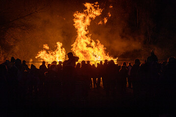 Fototapeta na wymiar People watch a bonfire at the annual firework display in Bicester.