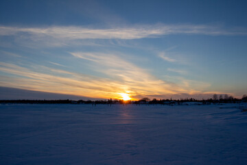 Sunset Over Frozen Lake