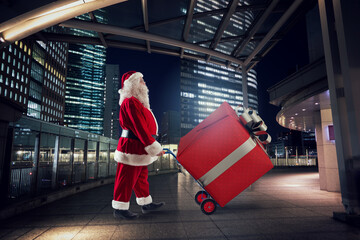 Santa claus delivers a big gift for Christmas