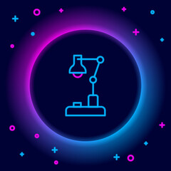 Glowing neon line Table lamp icon isolated on black background. Colorful outline concept. Vector