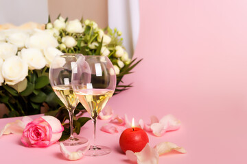 Romantic lovely holiday card with flowers and 2 glasses of italian white wine on pink background. Romantic atmosphere for people in love. Beautiful wedding day postcard. Happy Valentine`s Day.